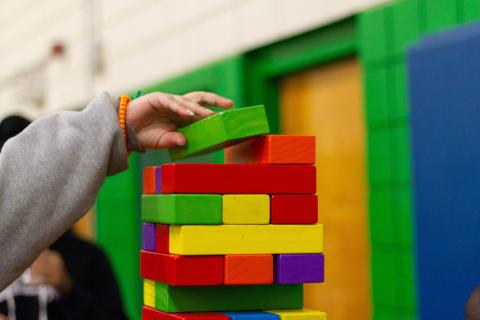 child playing with colorful blocks
